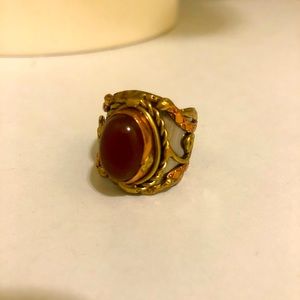 Silver/bronze metal rings with rust/Red gemstone